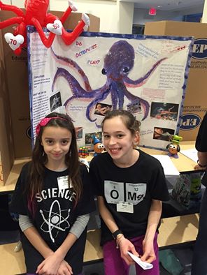 Maya (at right) and her cool school science project
