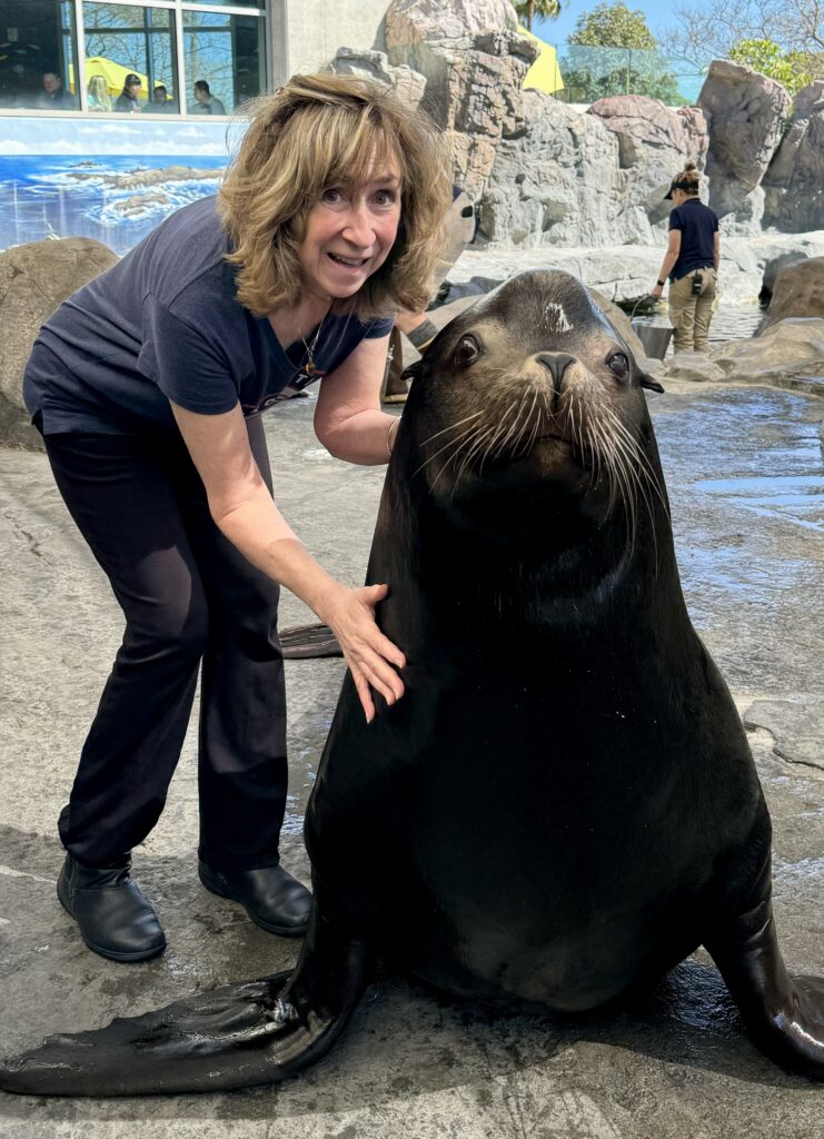 Sy visits Parker, a sea lion, before her talk at the Aquarium of the Pacific in Long Beach, California